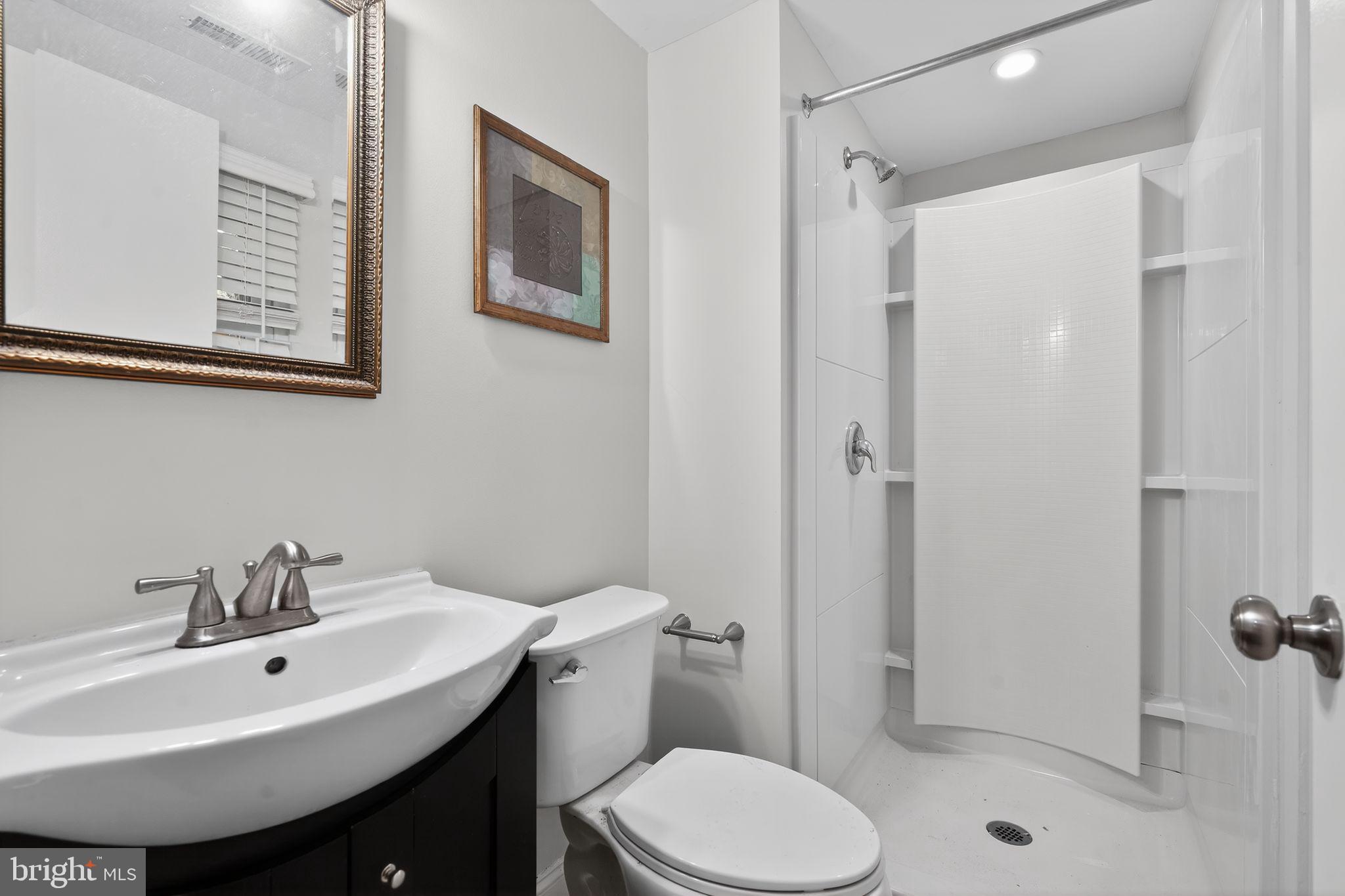 73 Greenvale Road Cherry Hill, NJ 08034 - Photo 18 of 23 a bathroom with a sink toilet and shower
