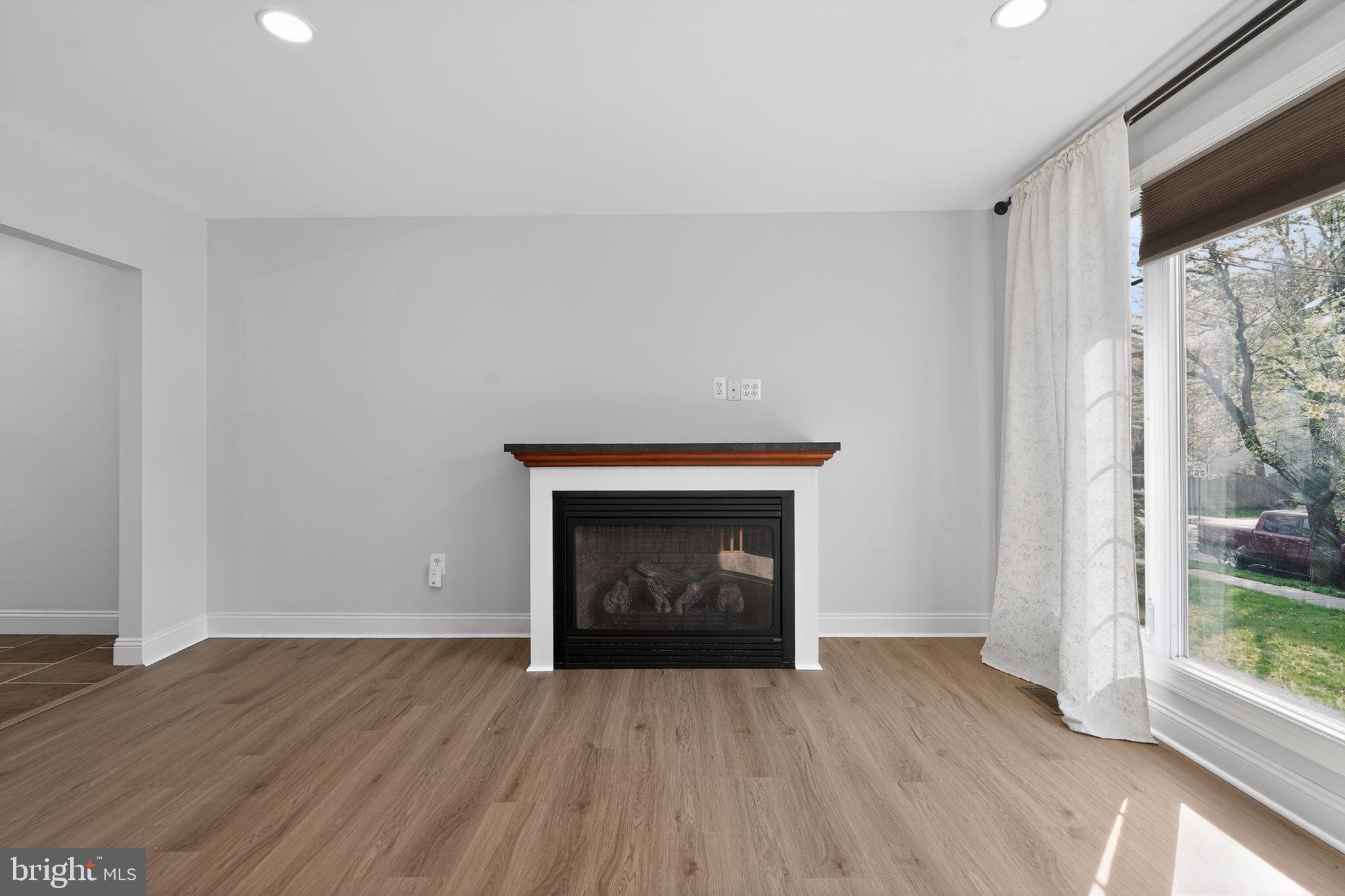 73 Greenvale Road Cherry Hill, NJ 08034 - Photo 10 of 23 a view of an empty room with wooden floor and a window