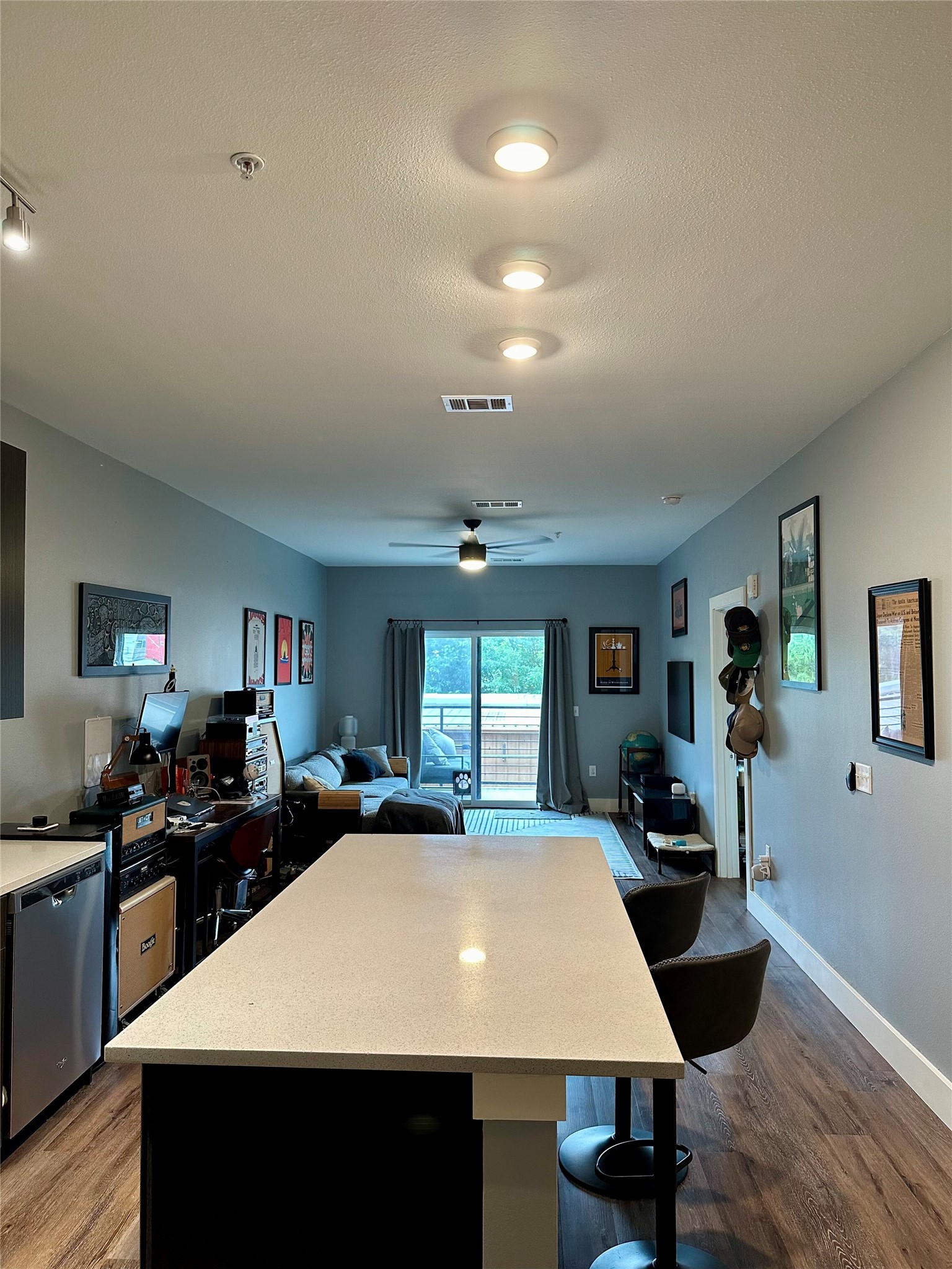 6444 Burnet Road, Unit 203 Austin, TX 78757 - Photo 4 of 30 This property features an open-concept living area with wood-style flooring and recessed lighting