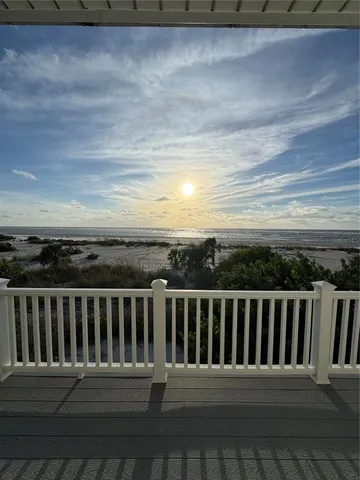 a balcony with wooden floor