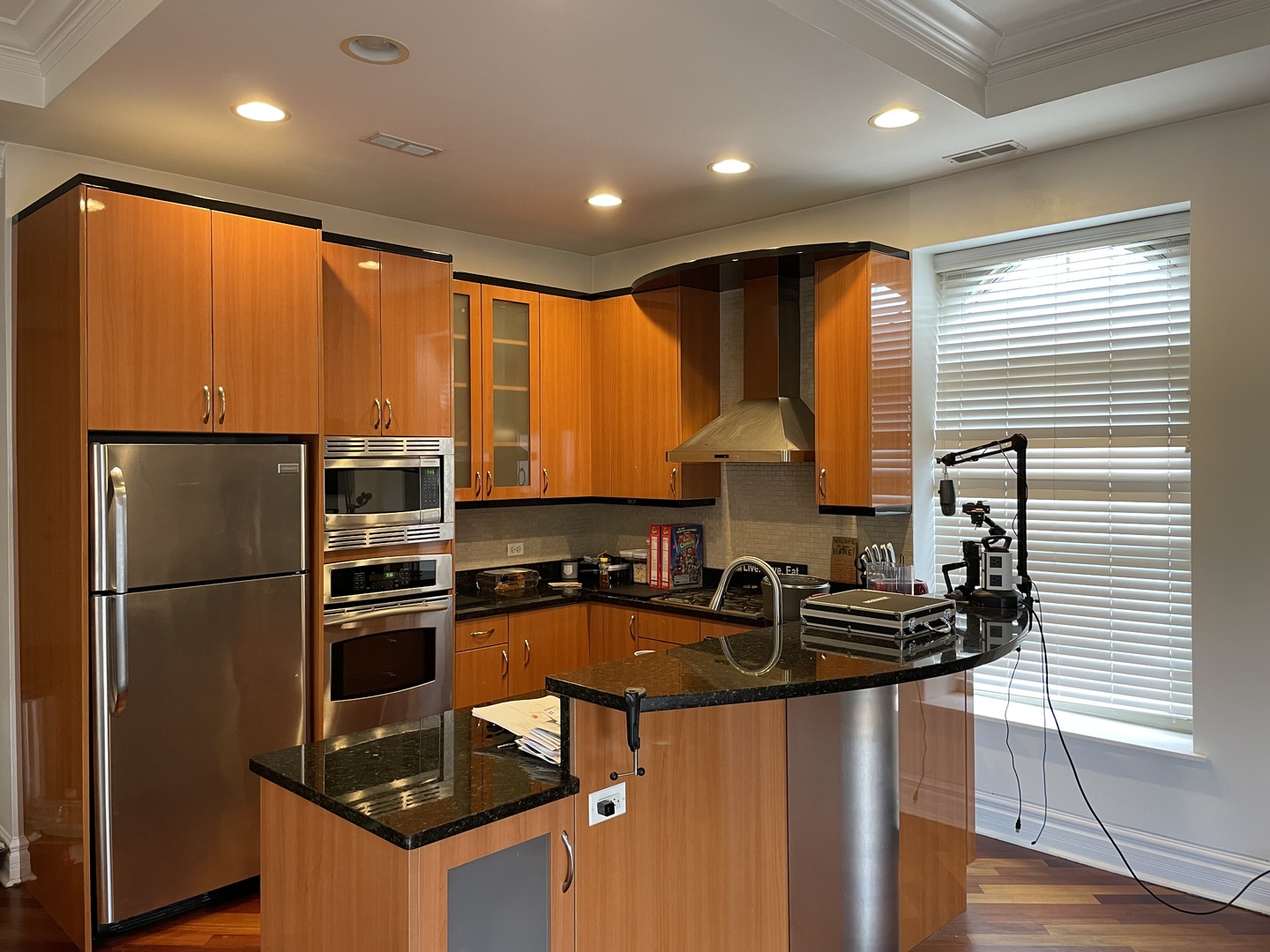36 South Ashland Avenue, Unit 501 Chicago, IL 60607 - Photo 2 of 12 a kitchen with kitchen island granite countertop a sink cabinets and stainless steel appliances