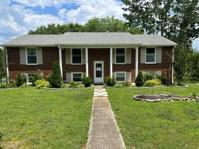 front view of a house with a yard