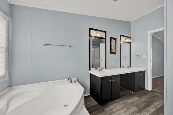 a en suite bathroom with a sink and mirror