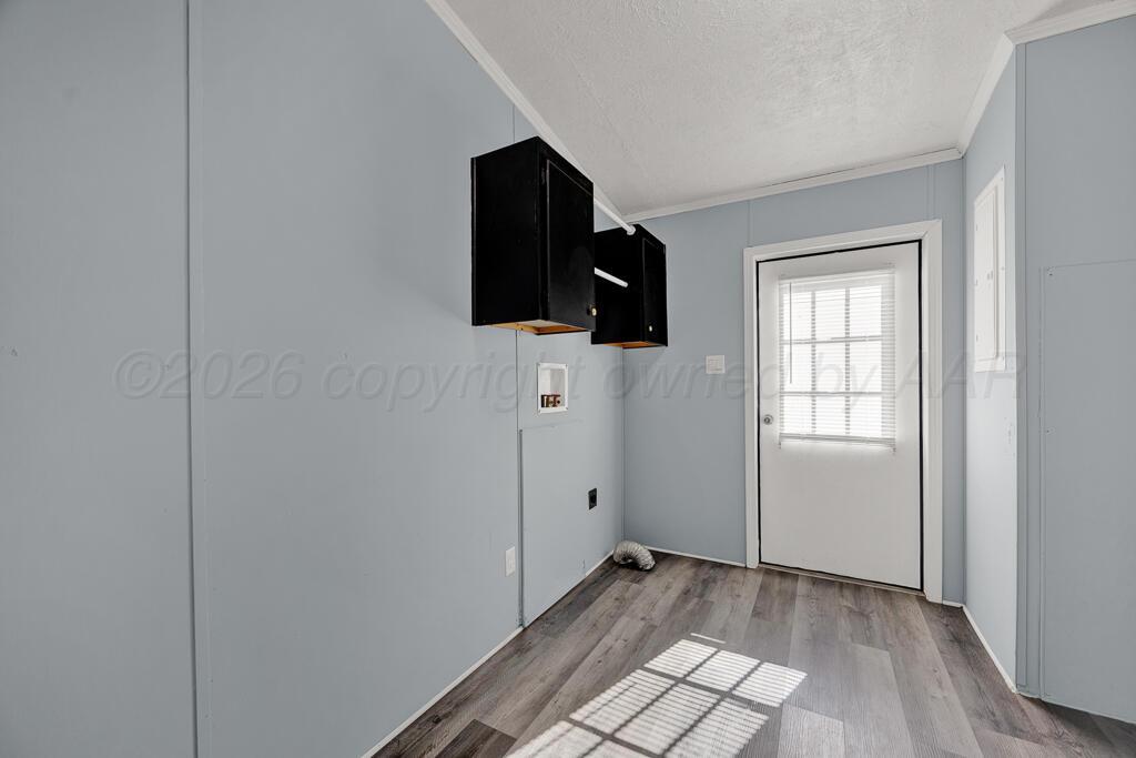 17650 Krabbe Street Canyon, TX 79015 - Photo 25 of 29 an empty room with wooden floor and windows