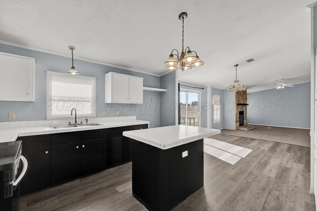 17650 Krabbe Street Canyon, TX 79015 - Photo 3 of 29 a large kitchen with kitchen island a sink stainless steel appliances and cabinets