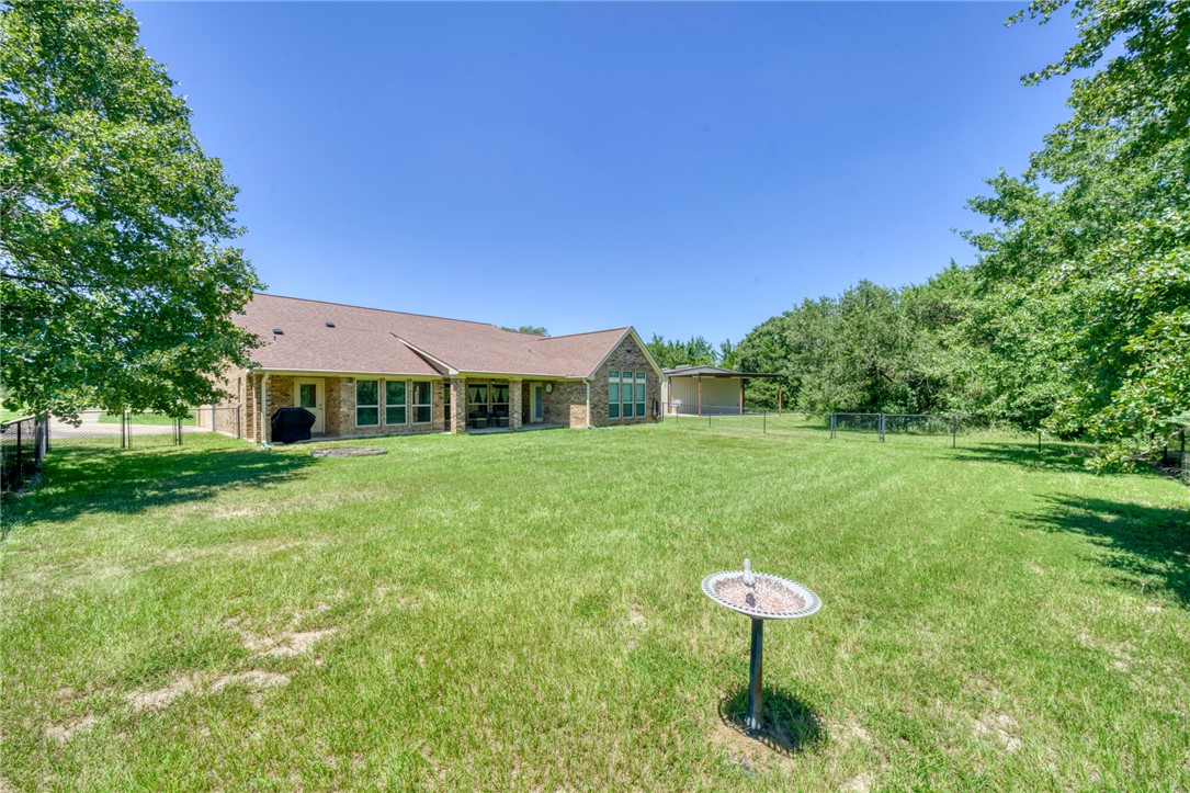 9945 Oxford Cemetery Road Madisonville, TX 77864 - Photo 28 of 42 View of yard with a patio area