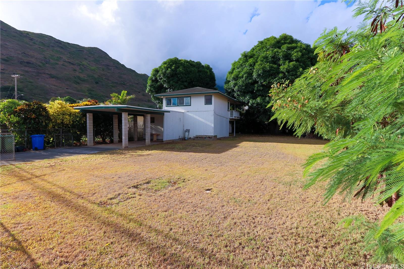 365 Kuliouou Road Honolulu, HI 96821 - Photo 1 of 1 a front view of a house with a yard and mountain view