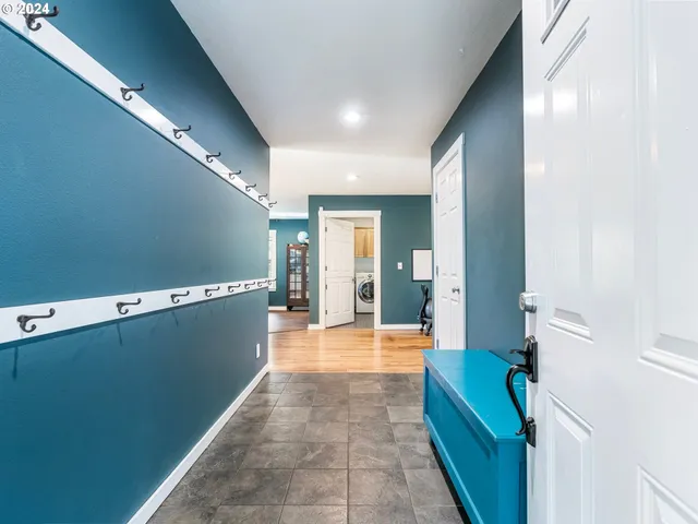 a view of a hallway with seating area