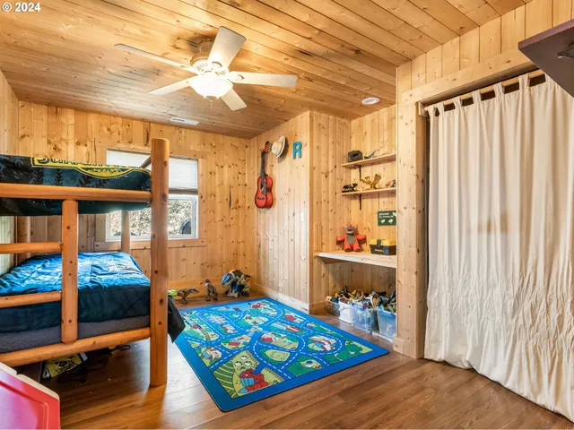 a bed room with furniture and a window