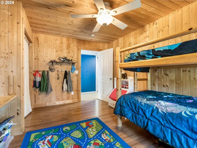 a bathroom with a sink a toilet a mirror and shower