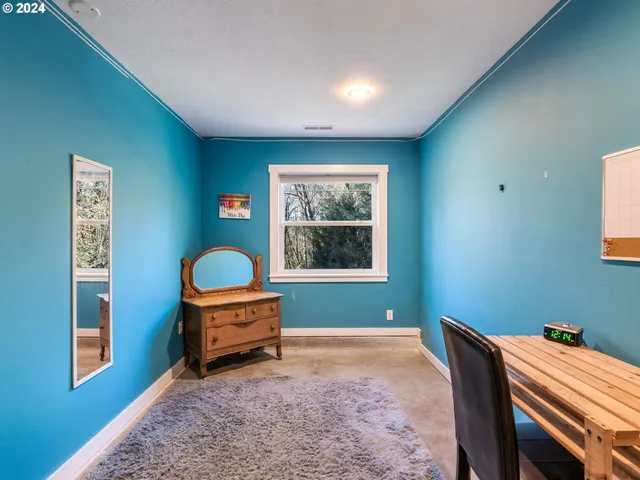 a view of a chairs and table in the garden