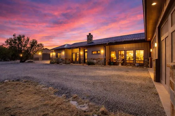 a room with stainless steel appliances kitchen island a large counter top and a stove