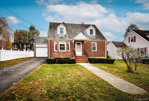 a front view of a house with yard