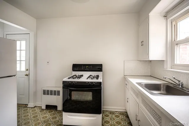 a kitchen with a stove and a sink