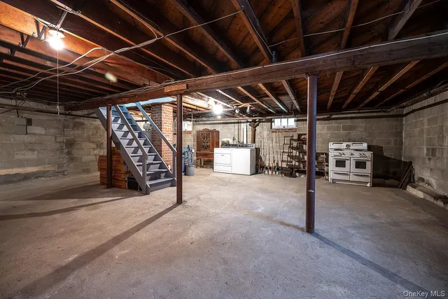 a view of empty room with wooden ceiling