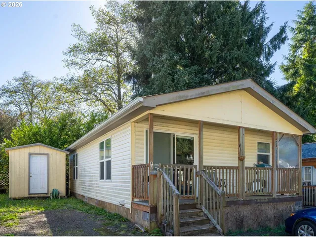 a view of a house with a yard and plants
