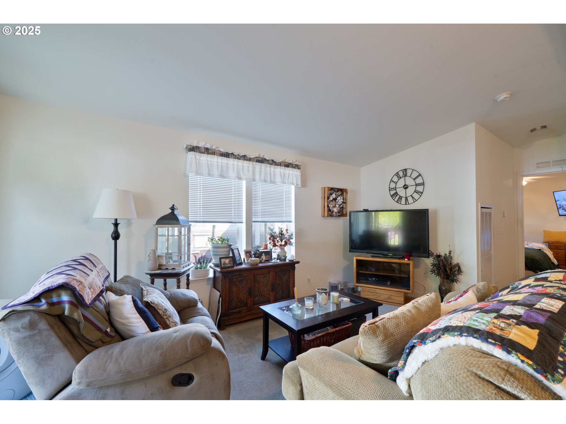 4850 Netarts Highway, Unit 6 Tillamook, OR 97141 - Photo 3 of 14 a living room with furniture and a flat screen tv