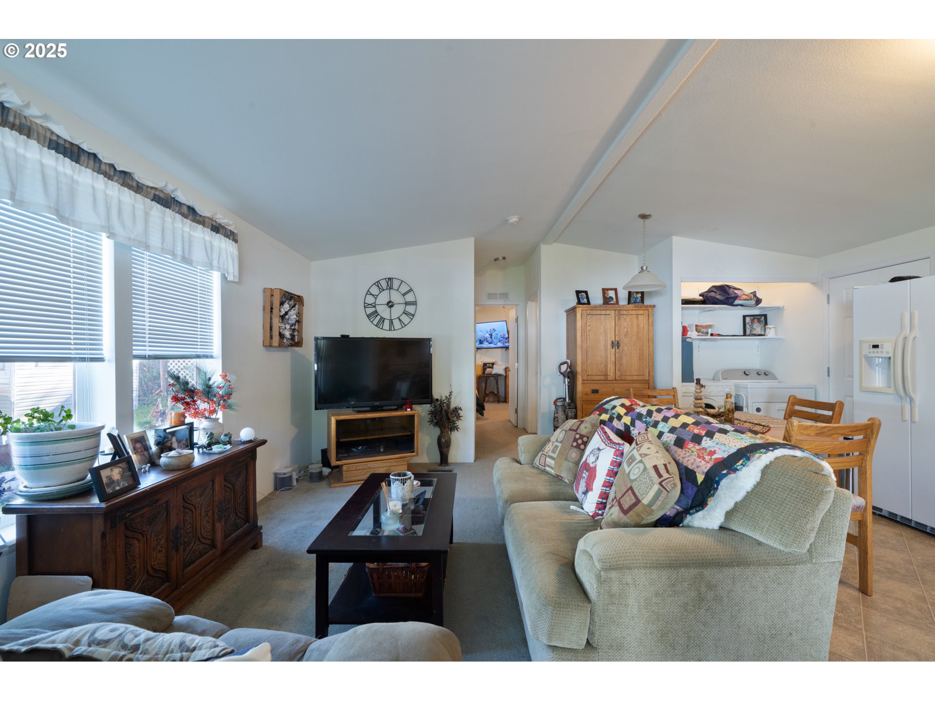 4850 Netarts Highway, Unit 6 Tillamook, OR 97141 - Photo 4 of 14 a living room with furniture and a flat screen tv