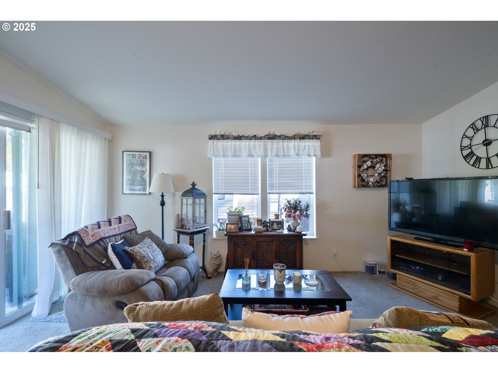 4850 Netarts Highway, Unit 6 Tillamook, OR 97141 - Photo 5 of 14 a living room with furniture and a flat screen tv