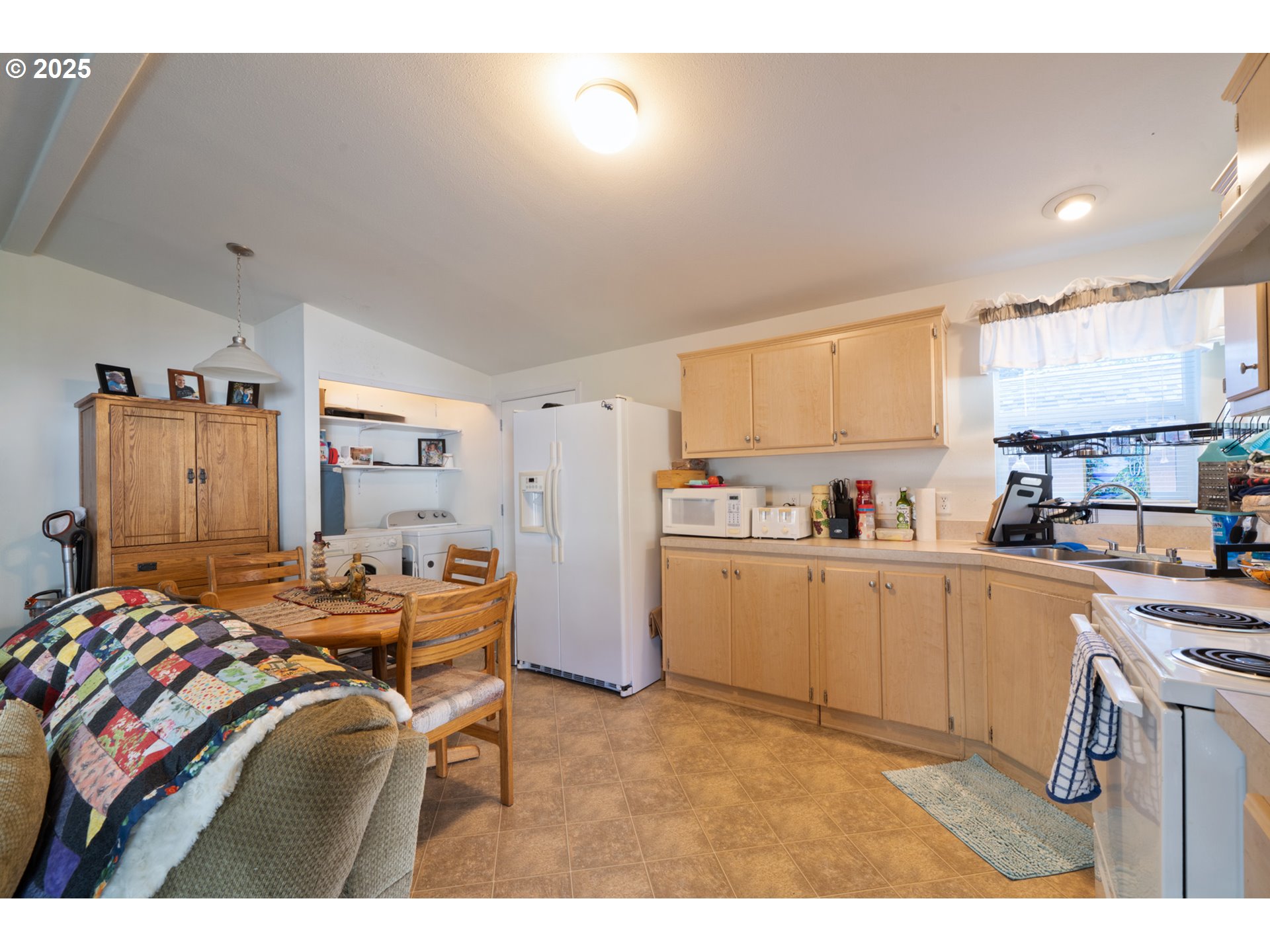 4850 Netarts Highway, Unit 6 Tillamook, OR 97141 - Photo 7 of 14 a kitchen that has a lot of cabinets in it and appliances