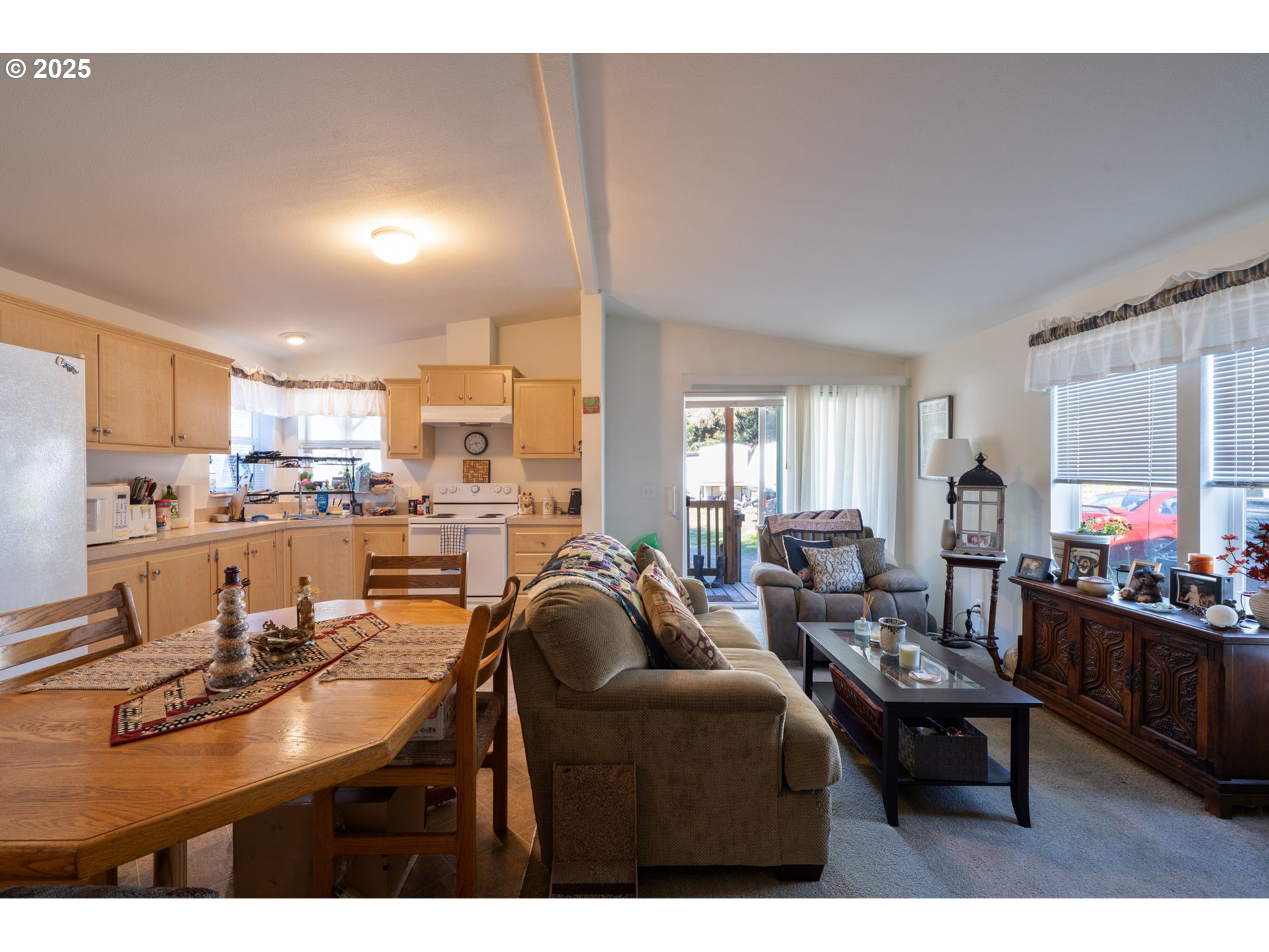 4850 Netarts Highway, Unit 6 Tillamook, OR 97141 - Photo 9 of 14 a living room with lots of furniture and kitchen view