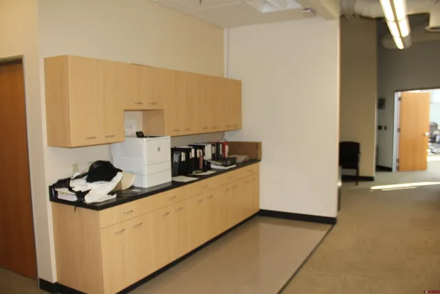 a kitchen with a sink and a stove top oven