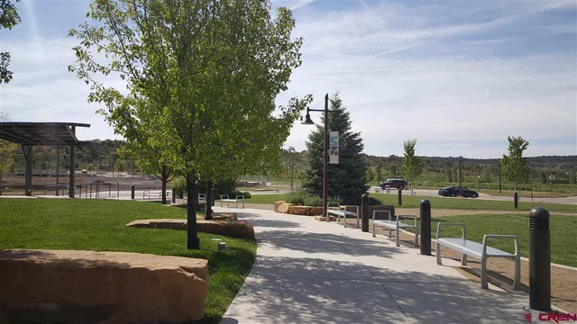 a view of a park with sitting area