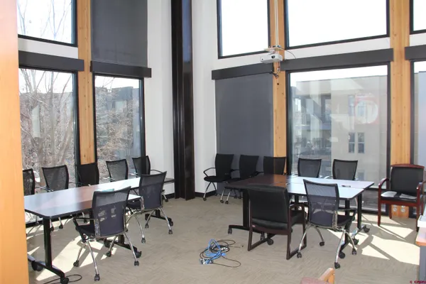 a view of a livingroom with furniture and a window