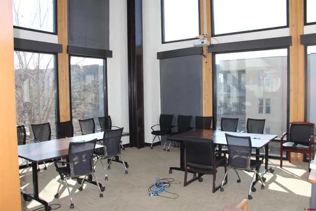 a view of a livingroom with furniture and a window