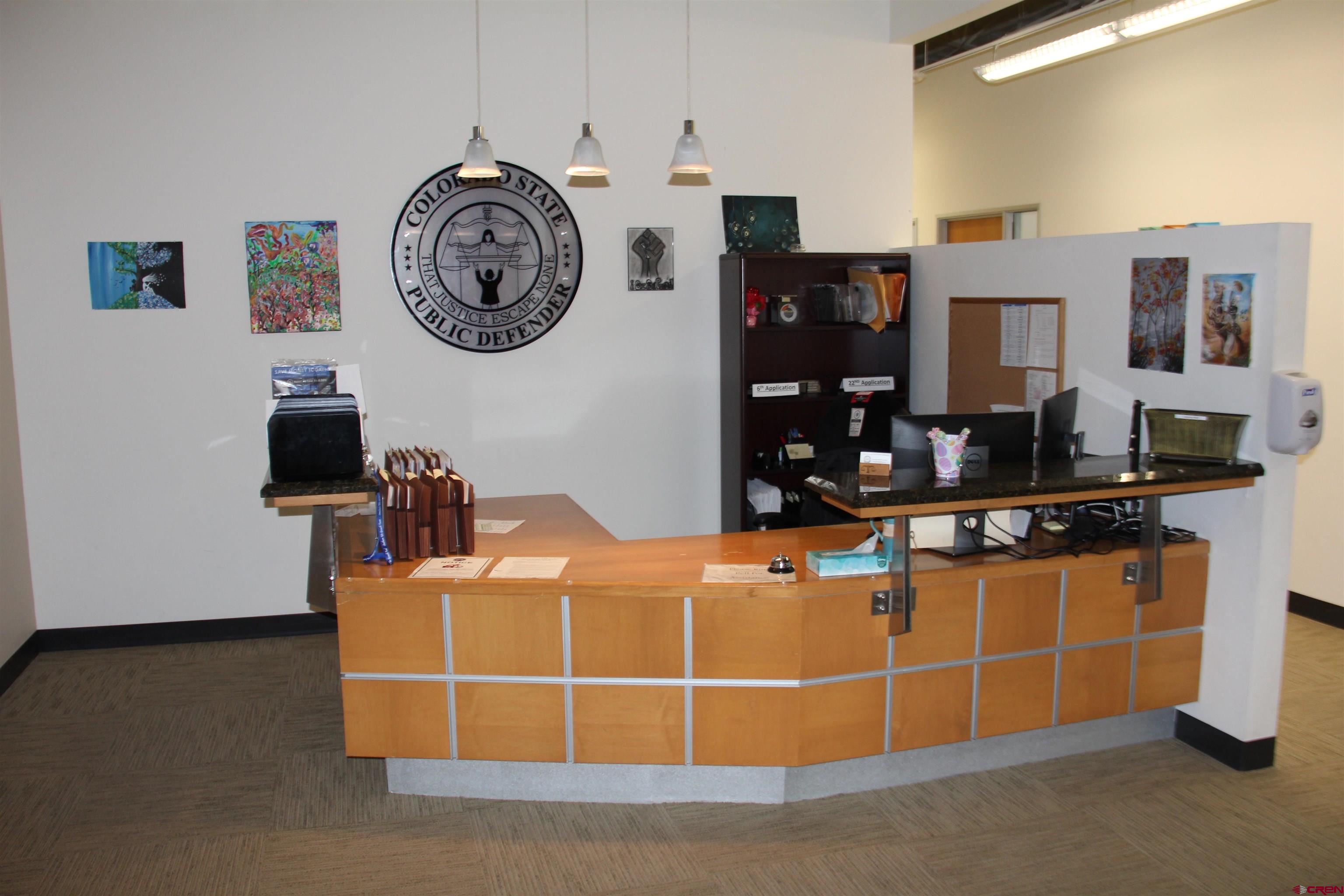 175 Mercado Street, Unit 250 Durango, CO 81301 - Photo 4 of 18 a room with a table and a clock