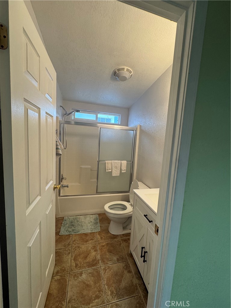 16 Magnolia Anaheim, CA 92801 - Photo 15 of 25 a bathroom with a granite countertop shower a toilet and a shower