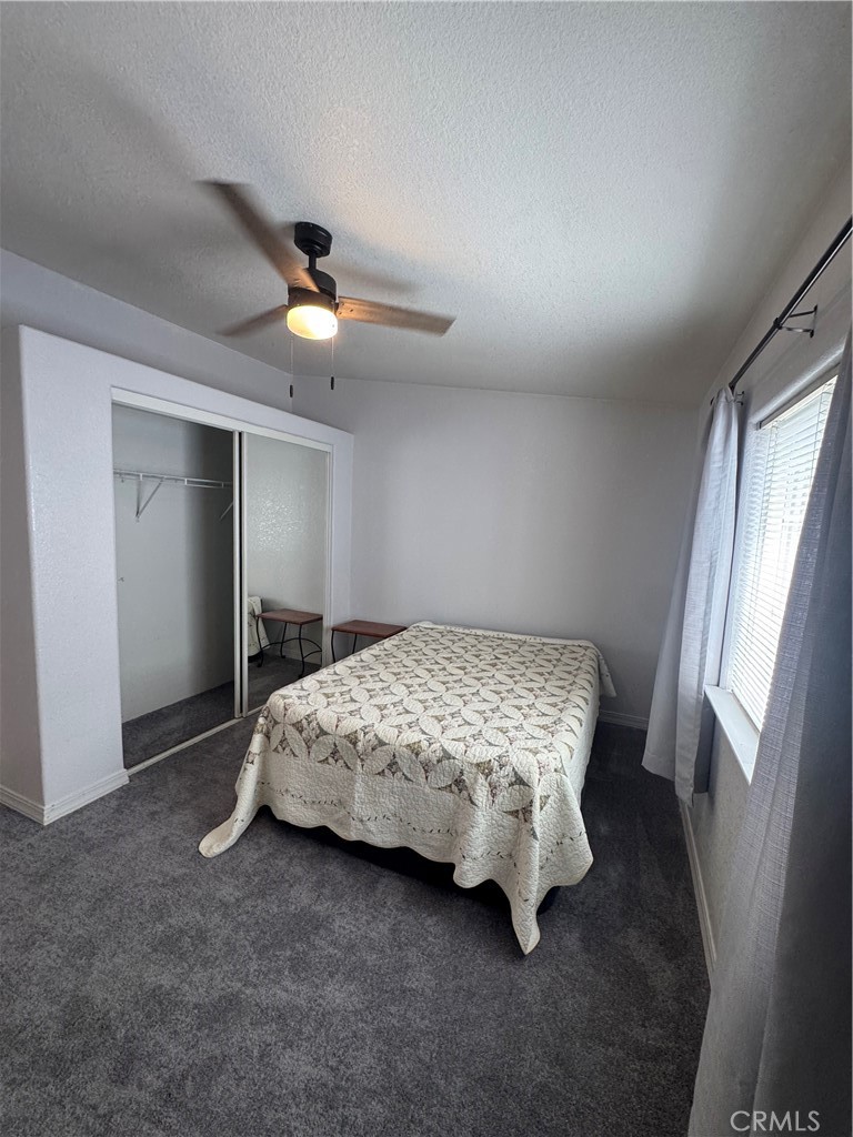 16 Magnolia Anaheim, CA 92801 - Photo 17 of 25 a bedroom with a bed and a chandelier