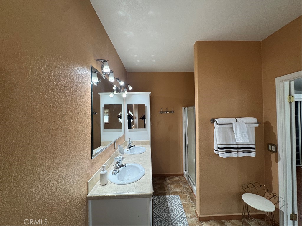 16 Magnolia Anaheim, CA 92801 - Photo 25 of 25 a bathroom with a sink vanity granite and a mirror