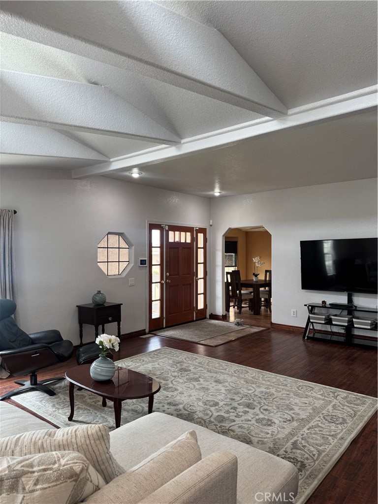 16 Magnolia Anaheim, CA 92801 - Photo 5 of 25 a living room with furniture and a flat screen tv