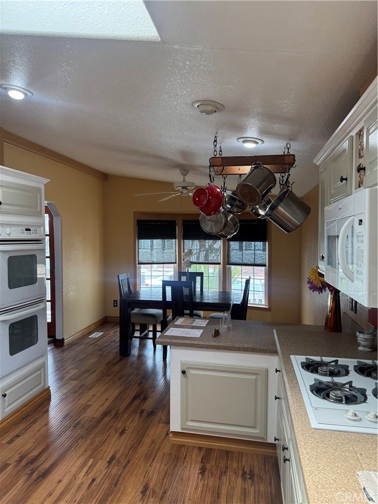 16 Magnolia Anaheim, CA 92801 - Photo 9 of 25 a kitchen with stainless steel appliances granite countertop a stove and cabinets