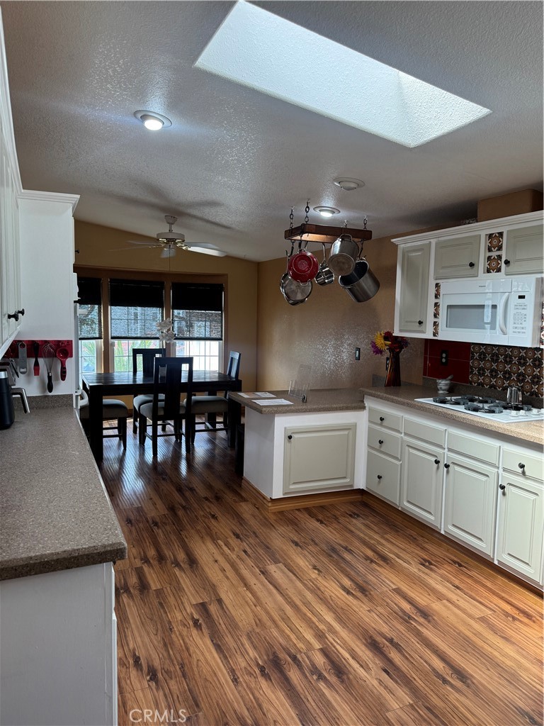 16 Magnolia Anaheim, CA 92801 - Photo 10 of 25 a kitchen with stainless steel appliances granite countertop a stove and cabinets