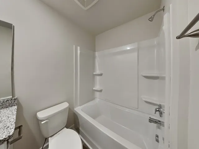 a brick house with a yard