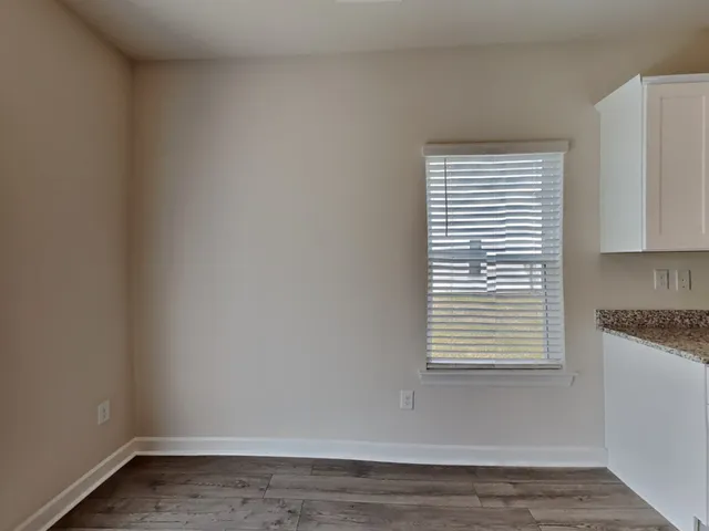 a view of a kitchen that has a window in it