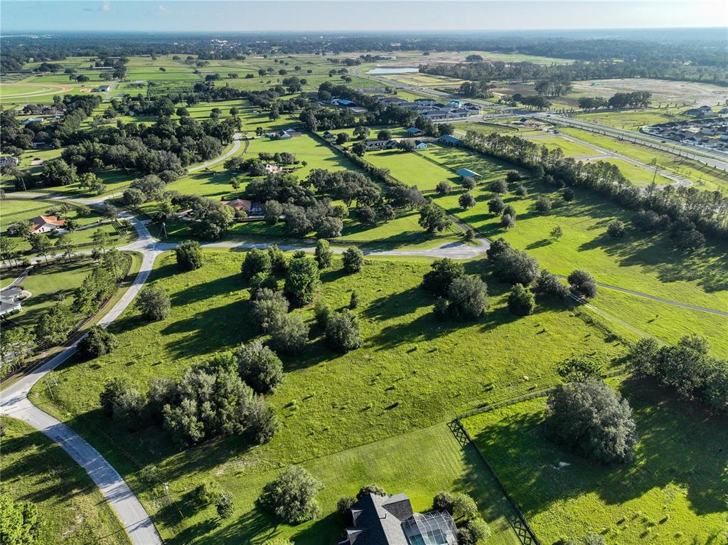 Tbd Southwest 52nd Court Ocala, FL 34476 - Photo 3 of 6 an aerial view of residential houses with outdoor space and trees