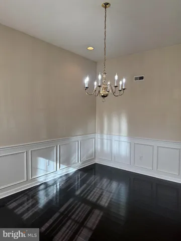 a view of room with window and hardwood floor