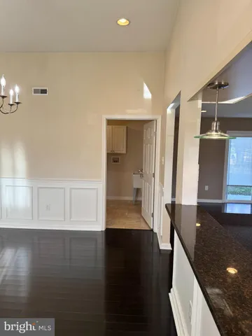 a view of a kitchen cabinets and a wooden floor