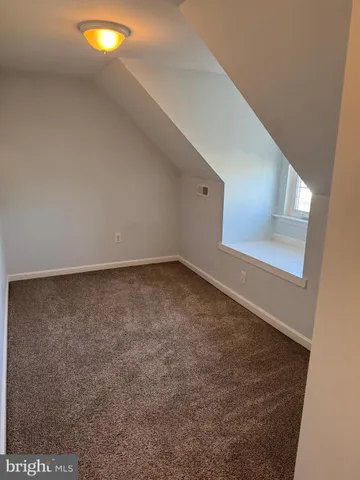 a view of a back yard from a balcony