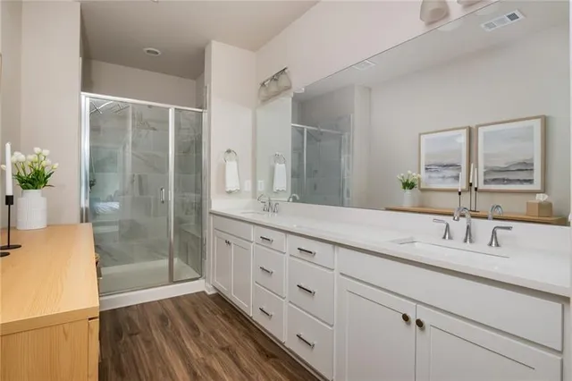 a view of a bedroom with baby crib and furniture