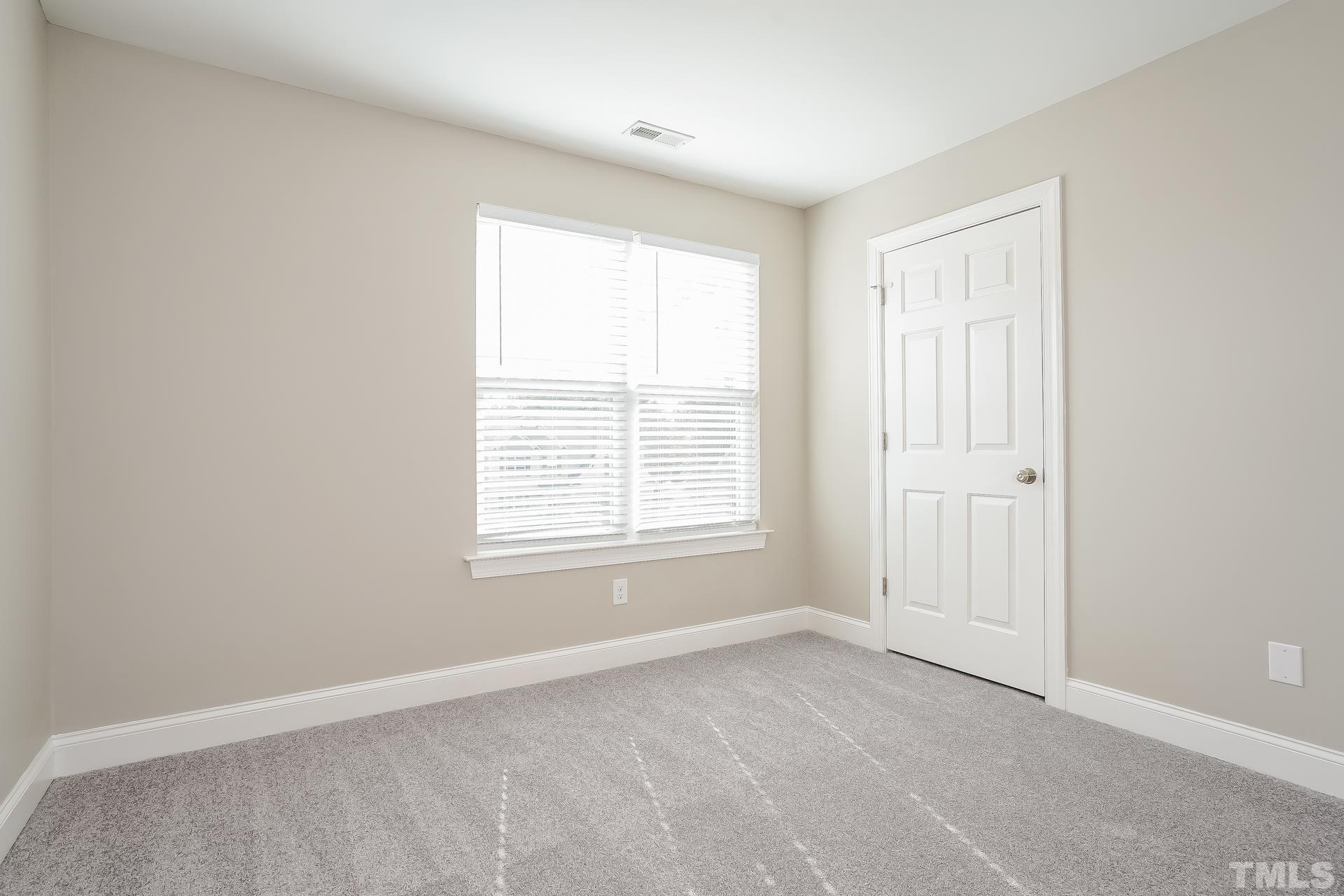 49 Burrage Drive Angier, NC 27501 - Photo 12 of 17 a view of an empty room with a window