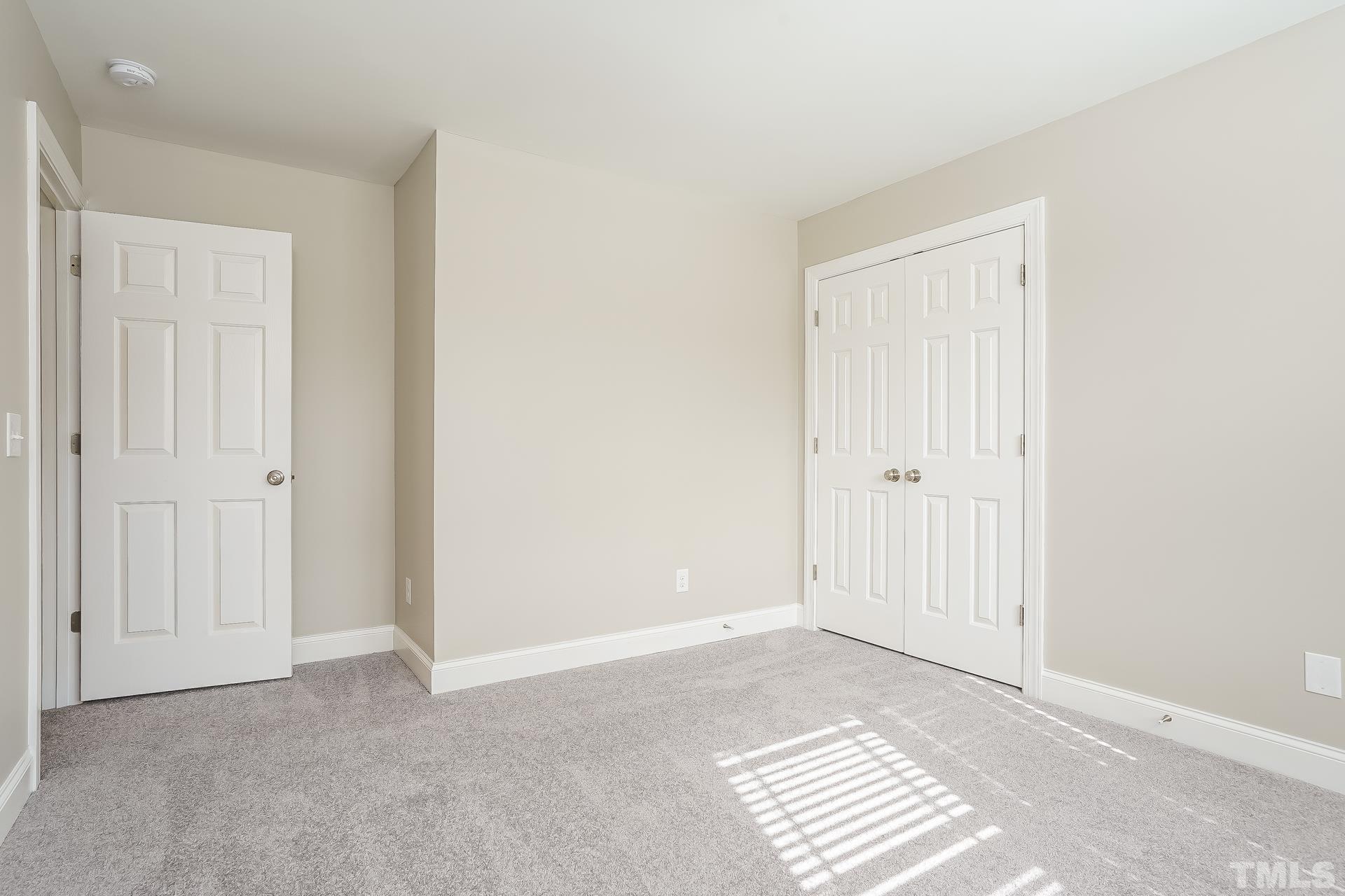 49 Burrage Drive Angier, NC 27501 - Photo 14 of 17 a view of wooden floor and windows in a room