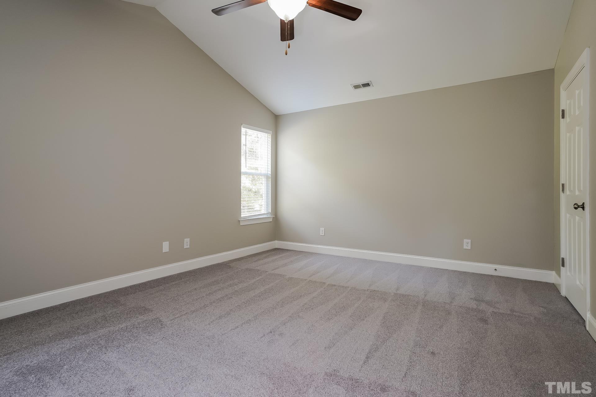 49 Burrage Drive Angier, NC 27501 - Photo 9 of 17 wooden floor in an empty room with a window