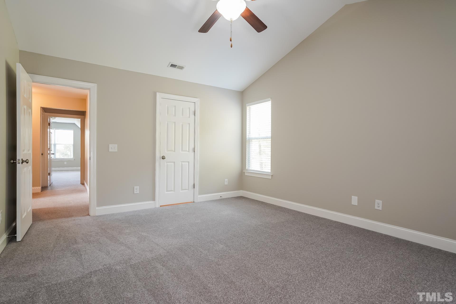 49 Burrage Drive Angier, NC 27501 - Photo 10 of 17 an empty room with a empty space and windows