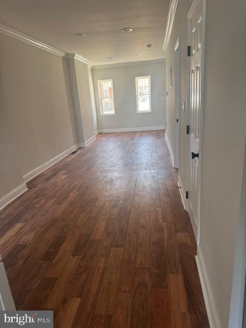 223 North Milton Avenue Baltimore, MD 21224 - Photo 5 of 14 a view of hallway with window and wooden floor