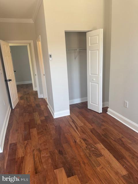 223 North Milton Avenue Baltimore, MD 21224 - Photo 8 of 14 a view of a hallway with wooden floor and staircase