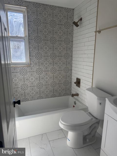 223 North Milton Avenue Baltimore, MD 21224 - Photo 9 of 14 a white toilet sitting next to a bath tub